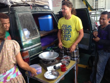 Gregory performing his cooking art  on the ferry